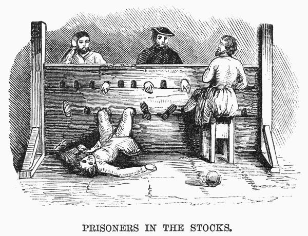 PRISONERS IN THE STOCKS. Medieval prisoners in the stocks. 19th century wood engraving.